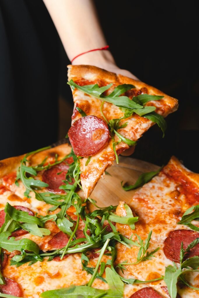 pexels-photo-17132216-17132216 Delicious pepperoni pizza topped with fresh arugula being served in Baku, Azerbaijan.